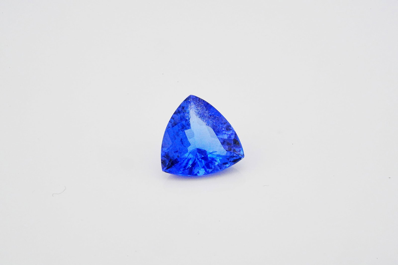 2.30ct Trillion-Cut Tanzanite: 2.30ct Trillion-Cut Tanzanite - This exceptional loose tanzanite showcases an approximately 2.30 carat trillion-cut gemstone of remarkable beauty and brilliance. Displaying a captivating blend of rich