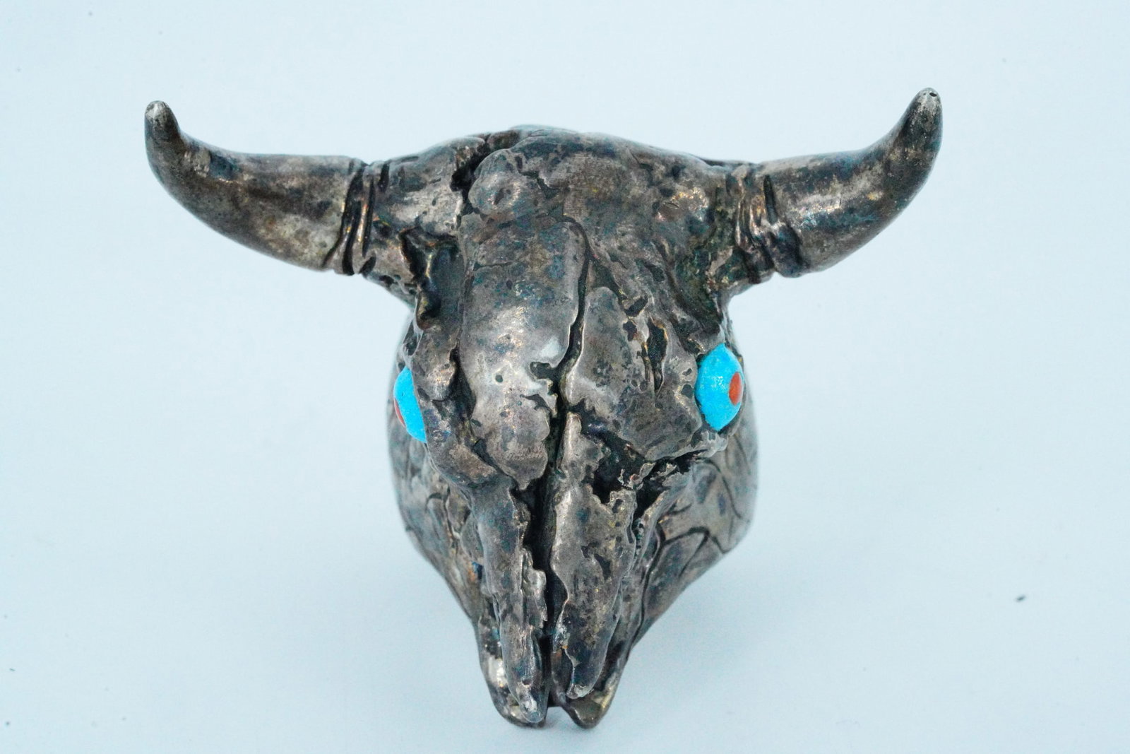 Native American Sterling Silver Cow Skull Ring: Native American Sterling Silver Cow Skull Ring W/Turquoise and Coral Accents (Signed) - This highly detailed Native American piece is crafted in sterling silver and depicts a cow skull. The ring is
