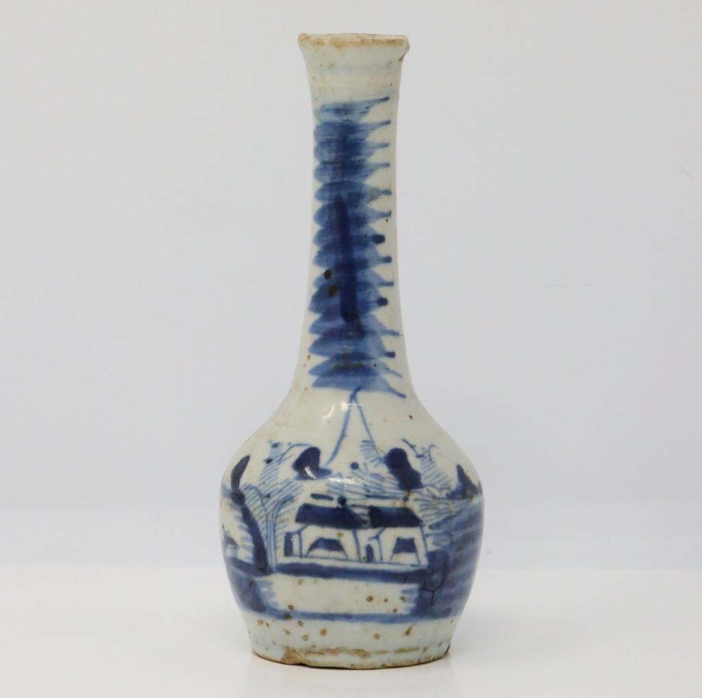 Vietnamese Blue and White Porcelain Vase: Vietnamese Blue and White Porcelain Vase W/Landscape Motif - This blue and white porcelain vase is decorated with a landscape village scene. Measurements: 6" x 2.75"W.