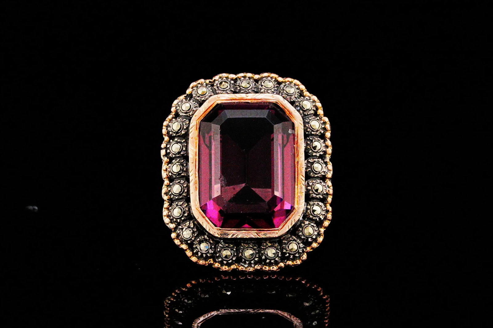 Sterling/Rose Gold, Amethyst Glass and Marcasite Ring: Sterling Silver and Rose Gold, Amethyst Glass and Marcasite Ring - Showcasing vintage-inspired elegance, this striking ring centers on an emerald-cut amethyst glass exhibiting a rich, saturated purple