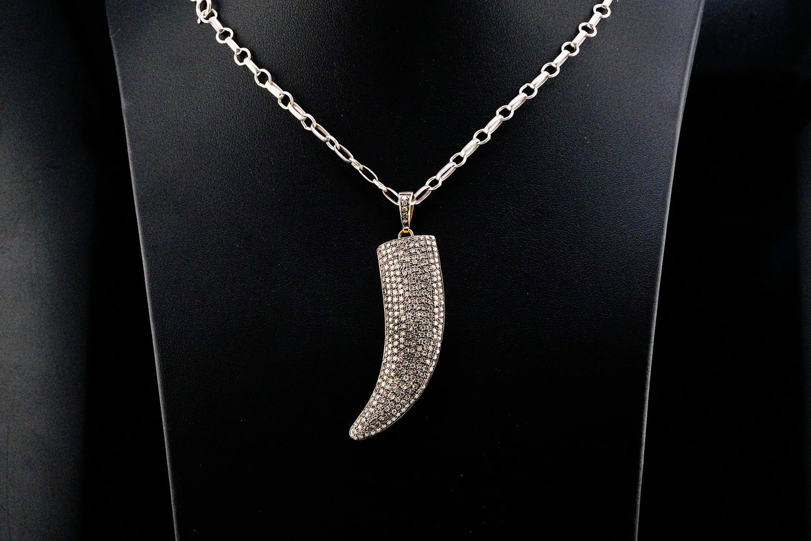 3.00ctw Brown Diamond, Sterling Silver and 10K Necklace: 3.00ctw Brown Diamond, Sterling Silver and 10K Gold Claw Pendant Necklace - Boldly designed with a rugged yet refined aesthetic, this striking necklace showcases a dramatic claw pendant crafted in ste