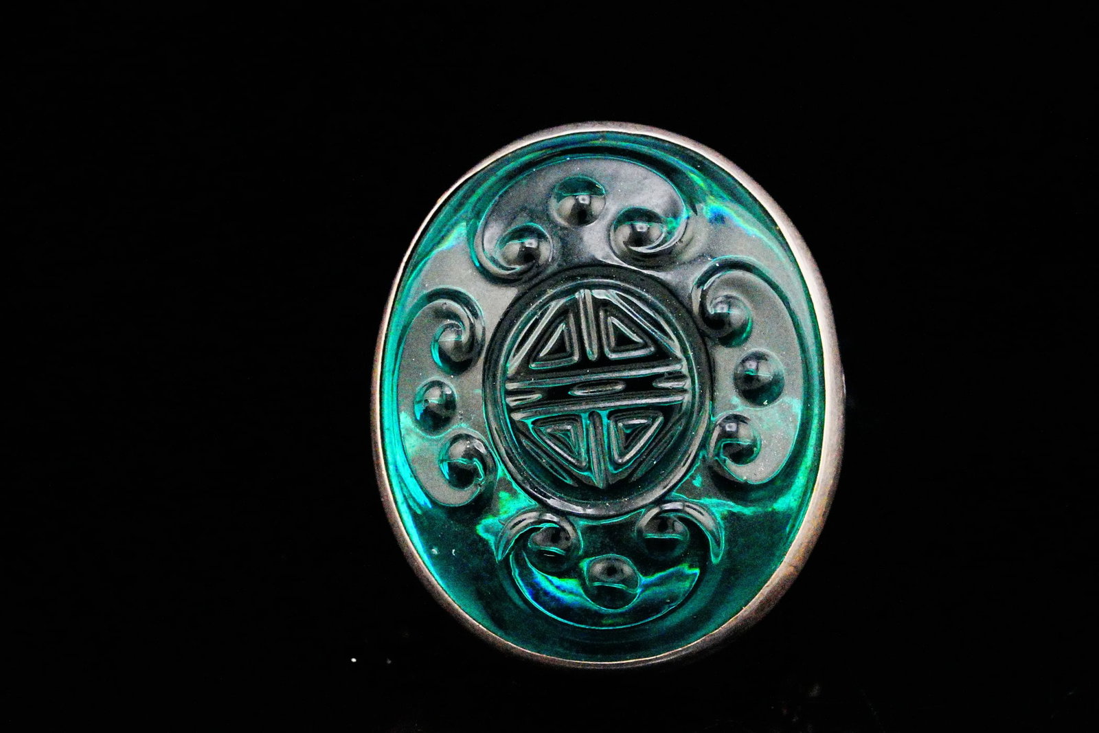 Vintage Sterling Silver Carved Green Glass Ring: Vintage Sterling Silver Carved Green Glass Statement Ring - This impressive vintage sterling silver ring showcases a large oval carved green glass cabochon featuring a traditional Chinese longevity sy