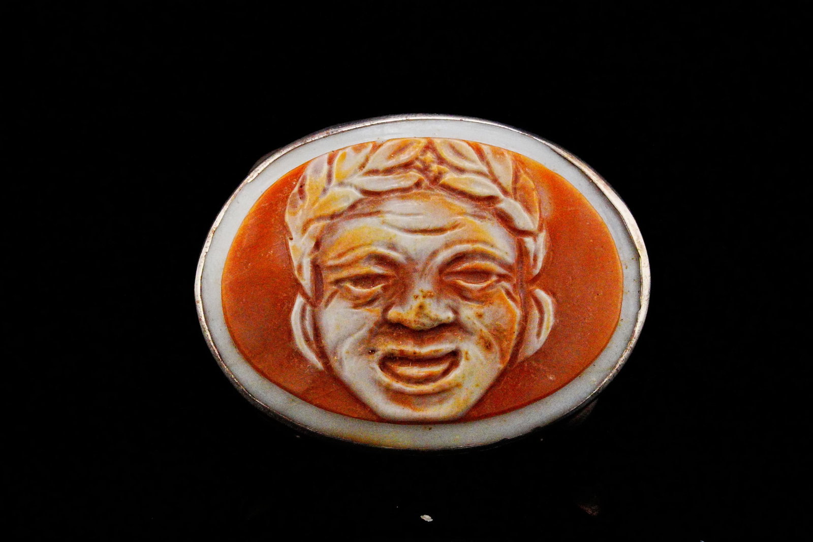 Vintage Sterling Silver and Carved Shell Cameo Ring: Vintage Sterling Silver and Carved Shell Cameo Ring - This striking vintage sterling silver ring showcases an expertly carved shell cameo depicting a smiling classical male figure in high relief.