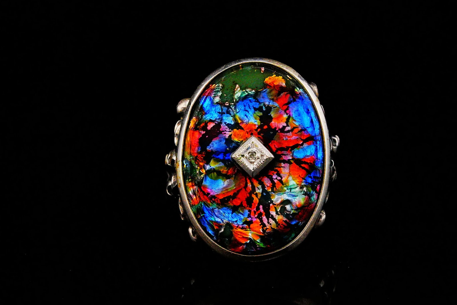 Vintage Sterling Silver and Art Glass Ring W/Diamond: Vintage Sterling Silver and Art Glass Ring W/Diamond Accent - This vintage sterling silver ring showcases a captivating art glass centerpiece accented by a sparkling diamond, creating an elegant