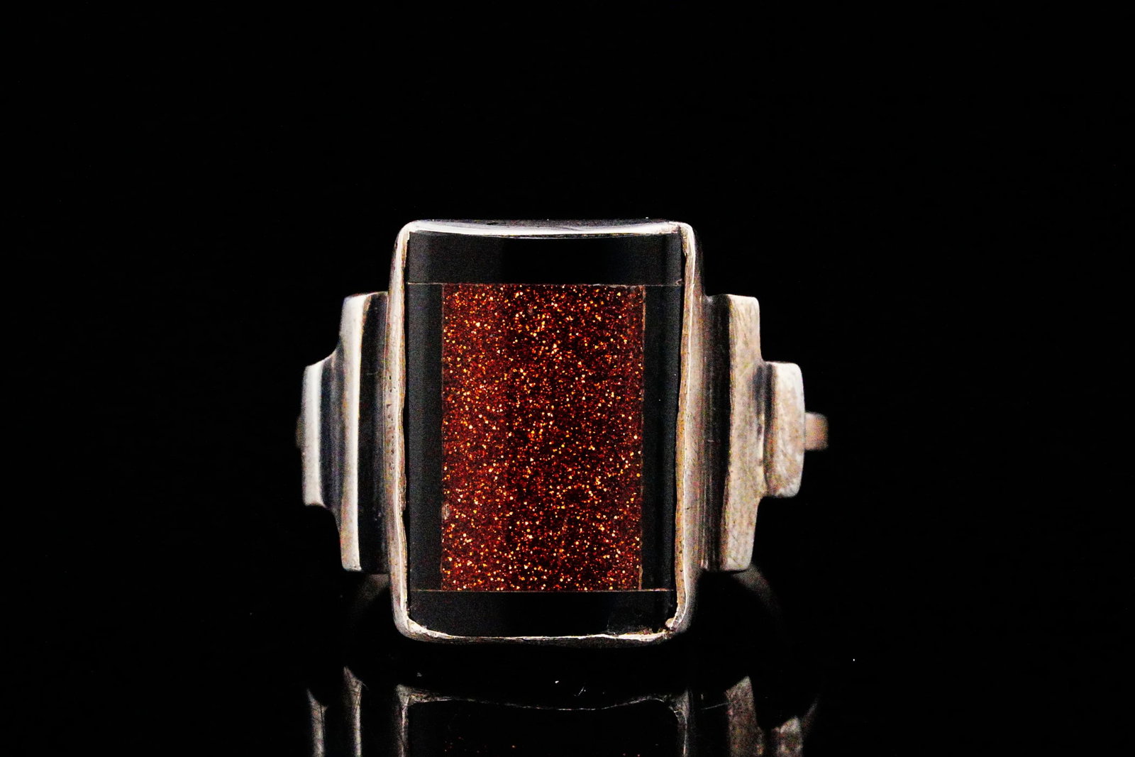 Vintage Sterling Silver, Goldstone and Onyx Ring: Vintage Sterling Silver, Goldstone and Black Onyx Ring - Bold and distinctly modernist, this vintage sterling silver ring showcases a striking rectangular inlay featuring shimmering goldstone framed