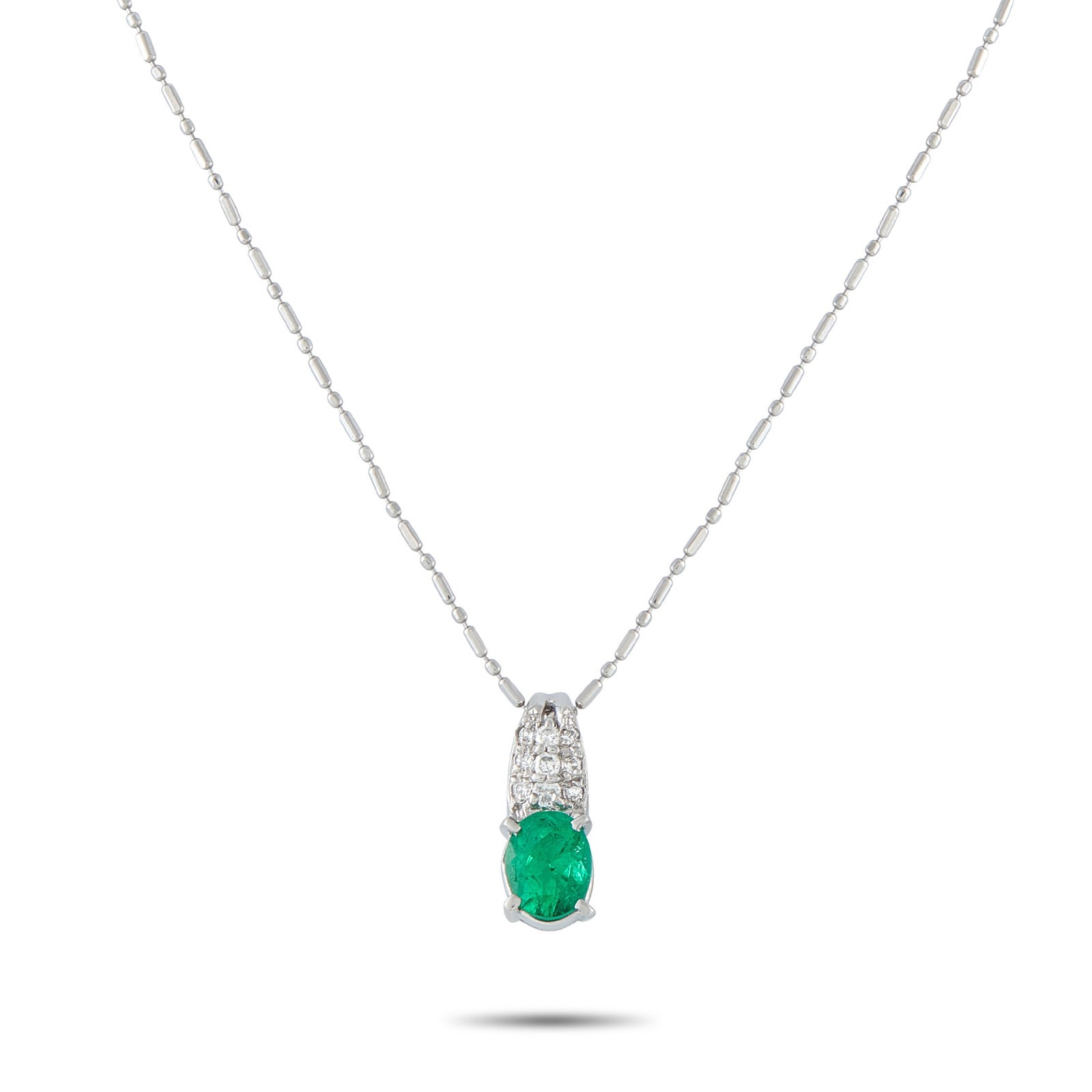 Platinum, 0.70ct Emerald and 0.10ctw Diamond Necklace: Platinum, 0.70ct Emerald and 0.10ctw Diamond 15" Pendant Necklace - Delicate and timeless, this elegant pendant necklace offers a refined touch of color and brilliance. Crafted in platinum, the gracef