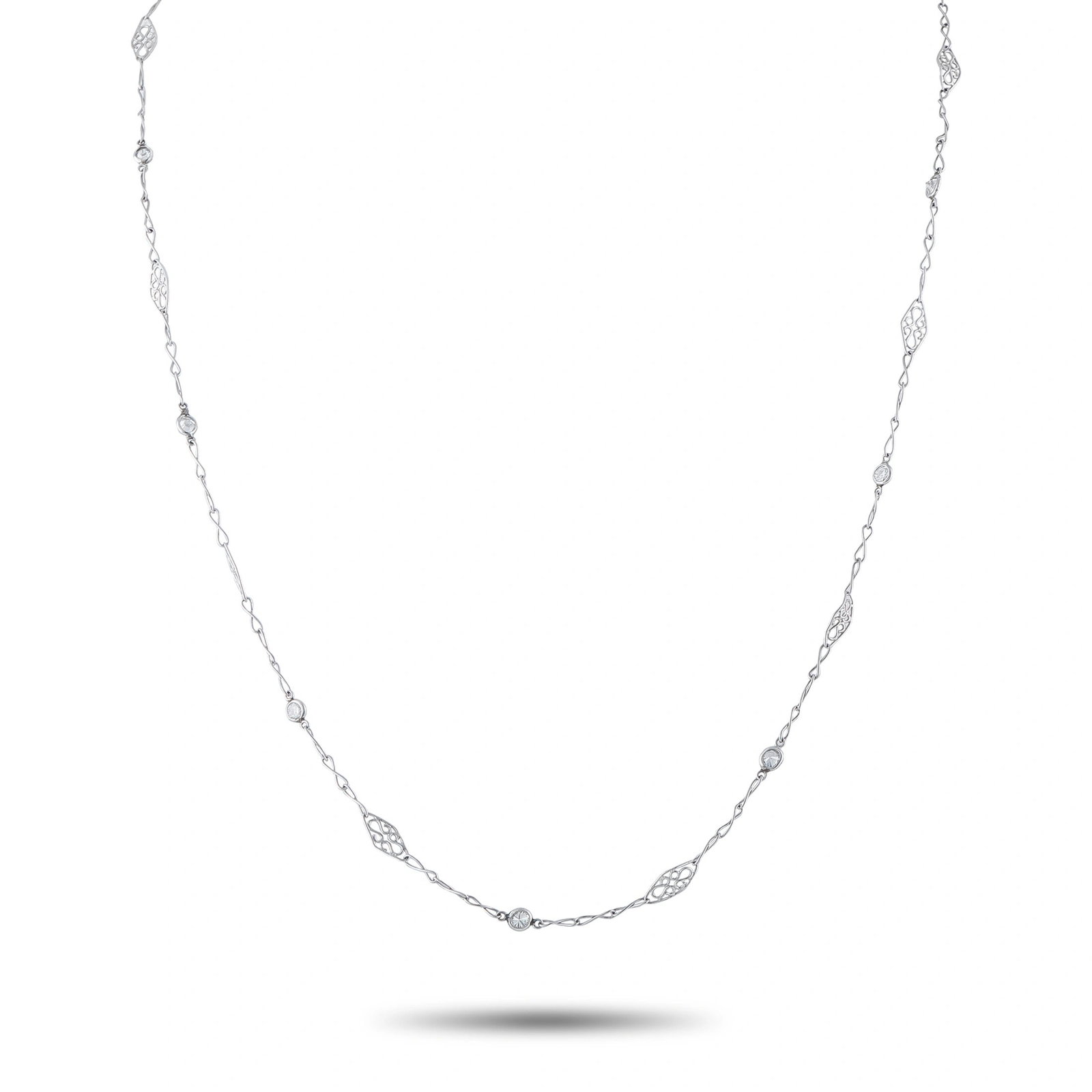Platinum and 0.50ctw Diamond 19" Station Necklace: Platinum and 0.50ctw Diamond 19" Station Necklace - An elegant interpretation of the diamonds-by-the-yard style, this sophisticated platinum necklace features approximately 0.50 carats of round brilli