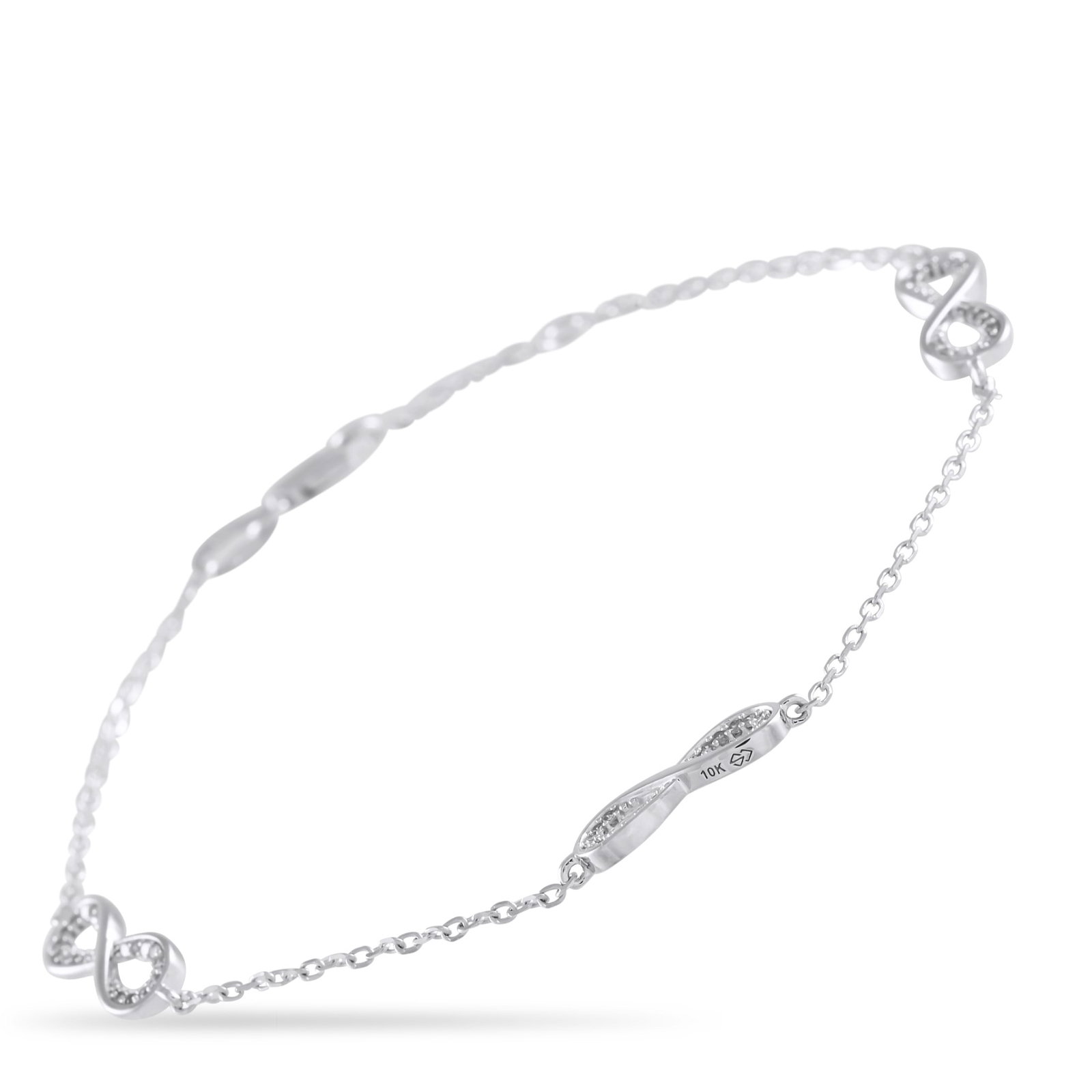 10K White Gold and 0.15ctw Diamond 7" Bracelet: 10K White Gold and 0.15ctw Diamond 7" Bracelet - A series of sleek infinity symbols add elegance and visual impact to this delicate bracelet. Crafted from 10K White Gold, it measures 7" long and is el
