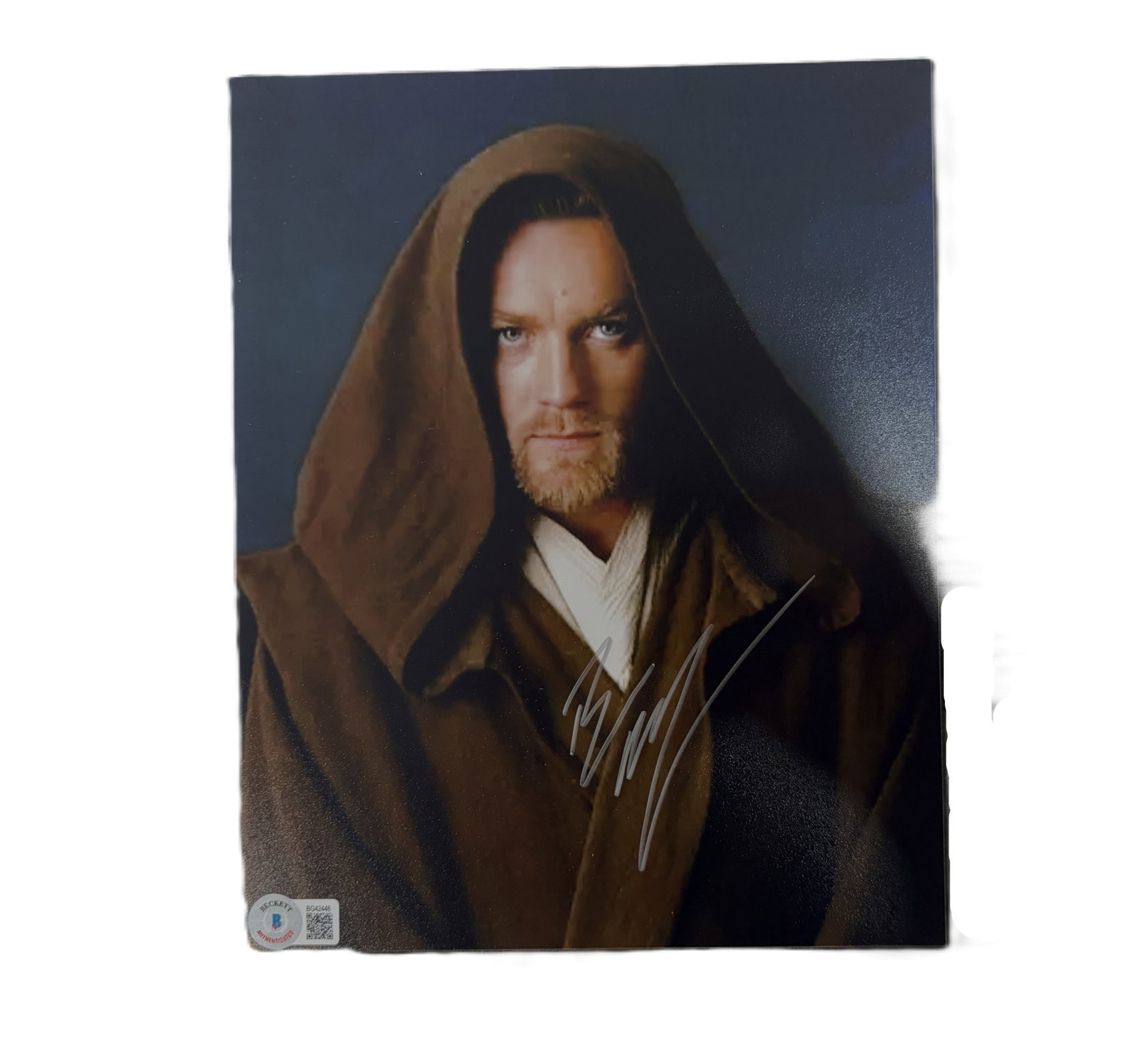 Ewan McGregor Signed 8 x 10-Inch Star Wars Photo (Beckett): Ewan McGregor Signed 8 x 10-Inch Star Wars Photo W/Beckett Authentication - A striking signed 8 x 10-inch color photograph of Ewan McGregor in his iconic role as Obi-Wan Kenobi from the Star Wars saga