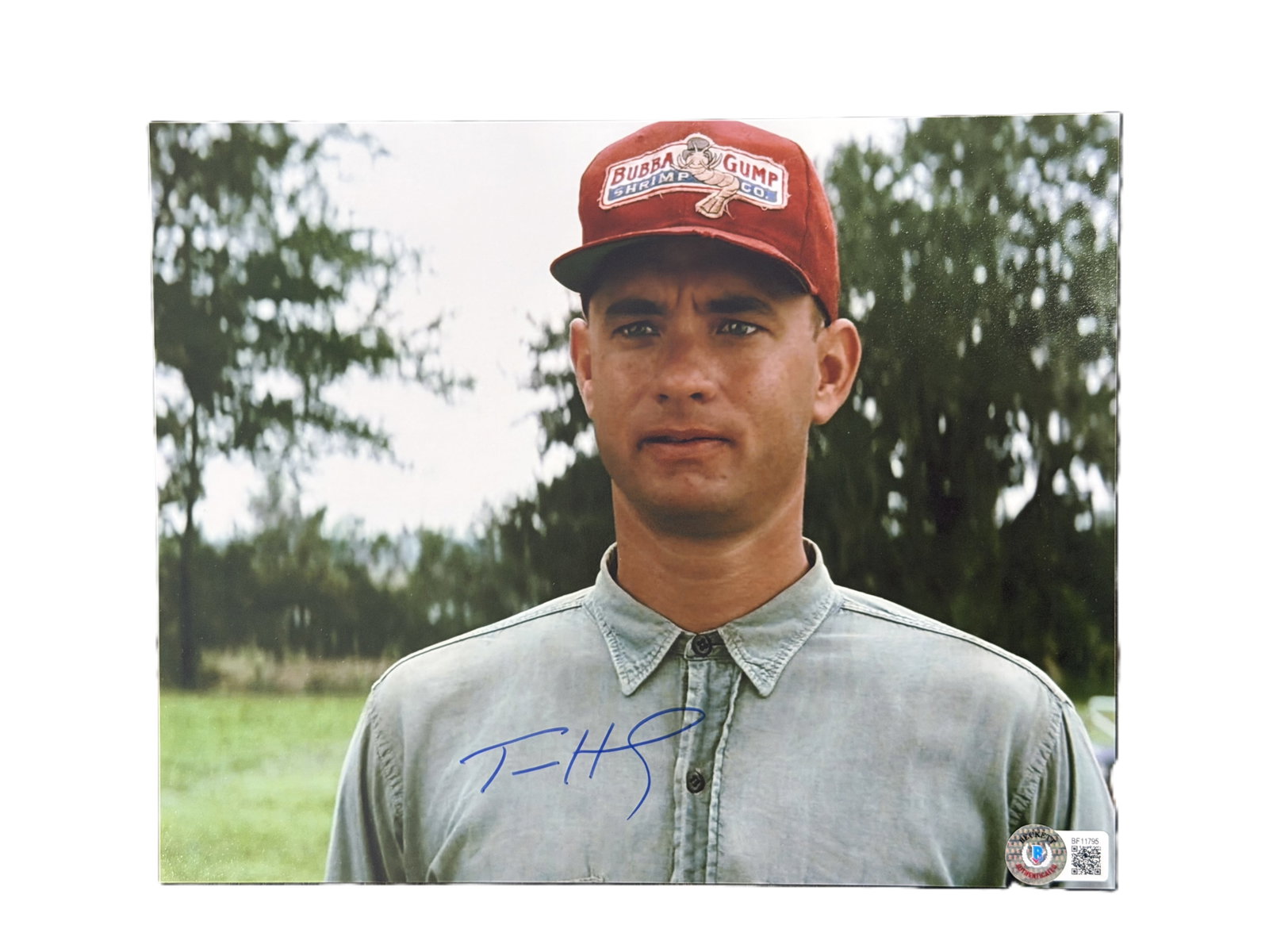 Tom Hanks Signed 8 x 10-Inch Forrest Gump Photo (Beckett): Tom Hanks Signed 8 x 10-Inch Forrest Gump Photo W/Beckett Authentication - A striking signed 8 x 10-inch color photograph of Tom Hanks in his iconic role as Forrest Gump, wearing the memorable Bubba G