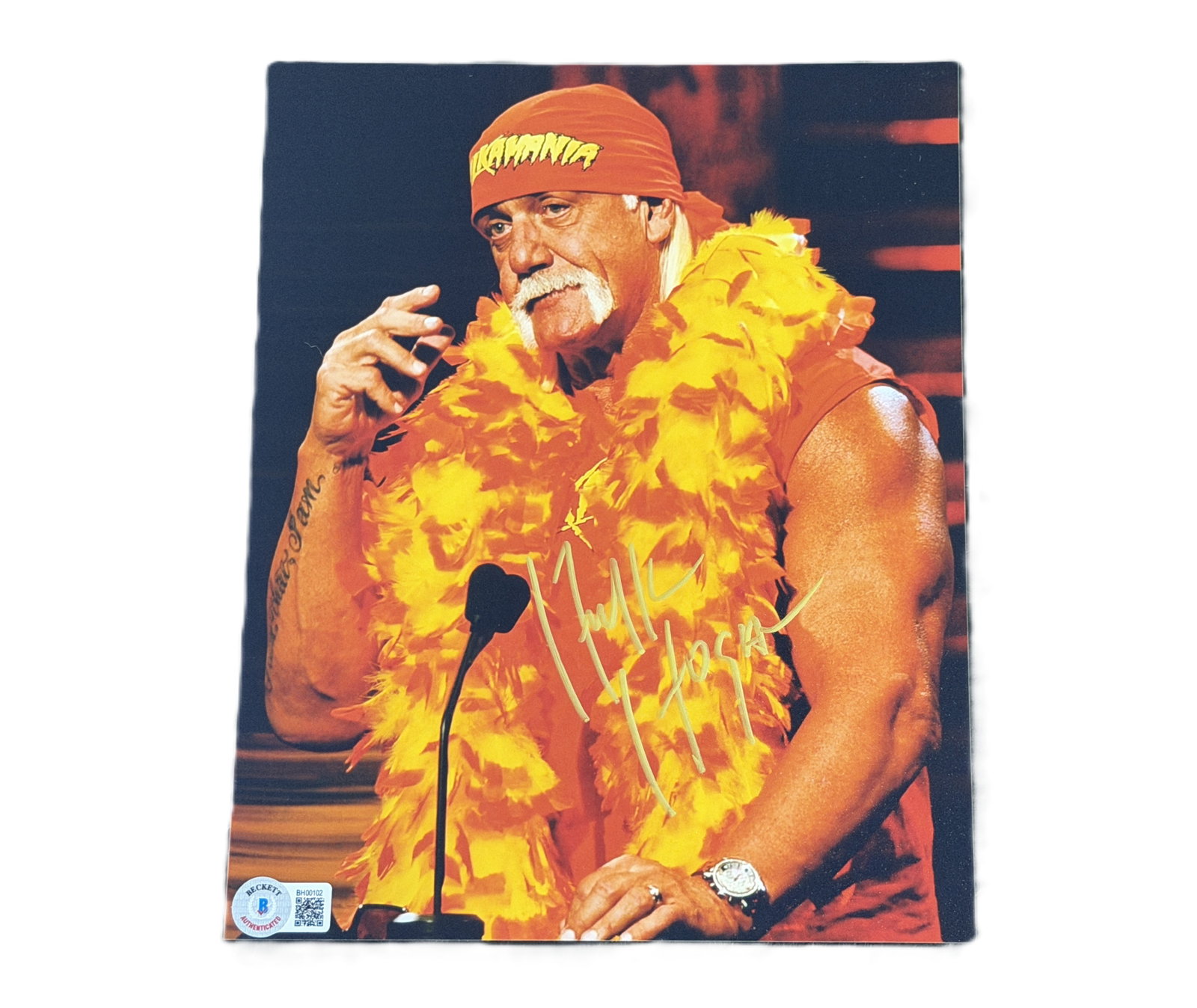 Hulk Hogan Signed 8 x 10-Inch Photo (Beckett): Hulk Hogan Signed 8 x 10-Inch Photo W/Beckett Authentication - A striking 8 x 10-inch color photograph capturing wrestling legend Hulk Hogan in one of his iconic appearances, wearing his signature red
