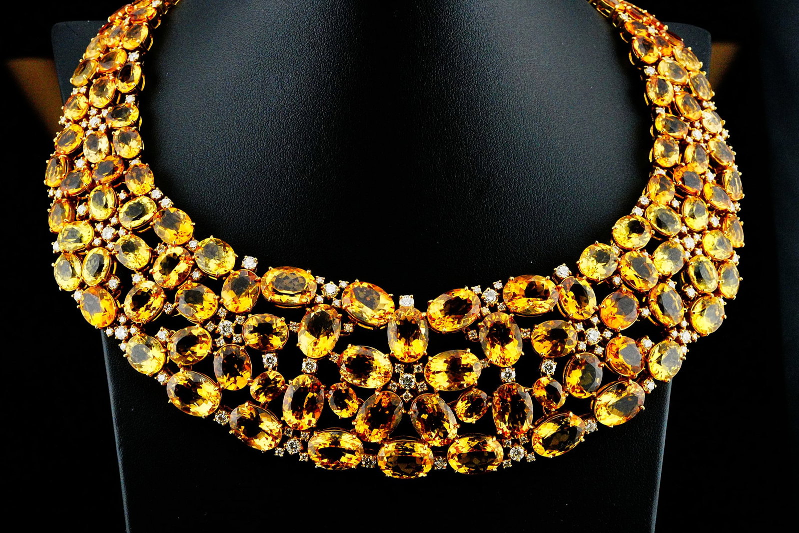 55ctw Beryl and Citrine, 11.80ctw Diamond, 18K Necklace: 55.00ctw Yellow Beryl and Citrine, 11.80ctw VS1-SI1/H-J Diamond and 18K Yellow Gold 14" Bib Necklace - An extraordinary statement necklace showcasing an opulent arrangement of approximately 55.00ctw o
