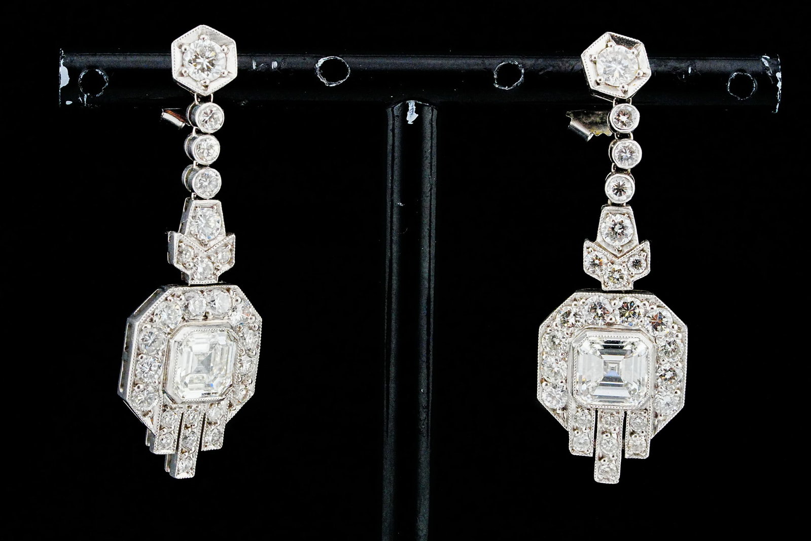 3.90ctw Diamond and Platinum 1.5" Vintage Drop Earrings: 3.90ctw VS1-SI1/G-H Diamond and Platinum 1.5" Vintage Drop Earrings - Exquisitely crafted in platinum, these elegant vintage drop earrings showcase a striking pair of asscher-cut diamonds at their