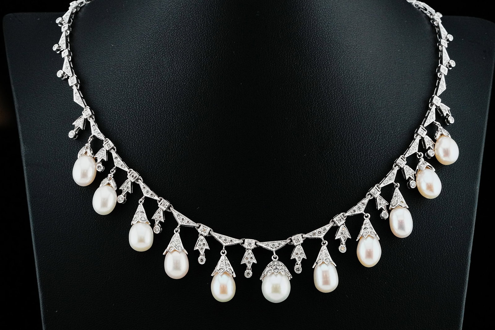 7.20ctw Diamond, 8mm Cultured Pearl and 18K Necklace: 7.20ctw VS1-SI1/G-H Diamond, 8mm Cultured Pearl and 18K White Gold 19" Necklace - Exquisitely crafted in 18K white gold, this elegant 19-inch necklace showcases a graceful fringe of luminous