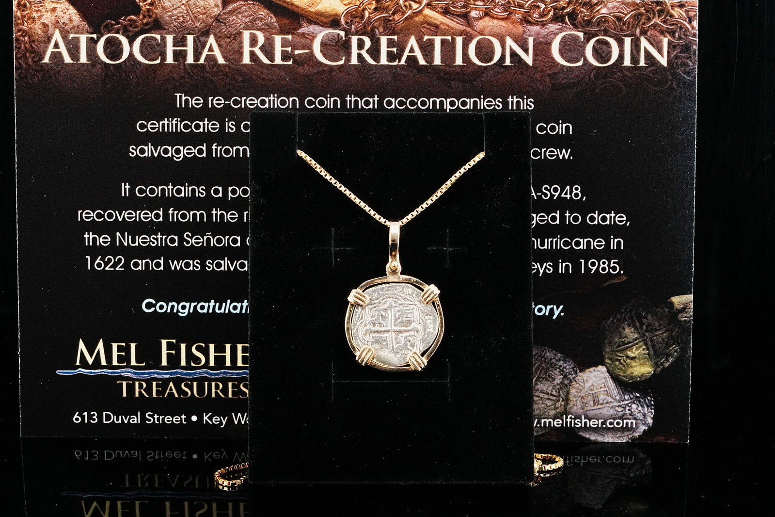 Atocha Shipwreck Silver Re-Creation Coin on 14K Chain: Authentic Atocha Shipwreck Silver Re-Creation Coin and 14K Gold Pendant on 24" 14K Box Chain - A striking maritime treasure inspired by one of the most legendary shipwreck discoveries in history. This