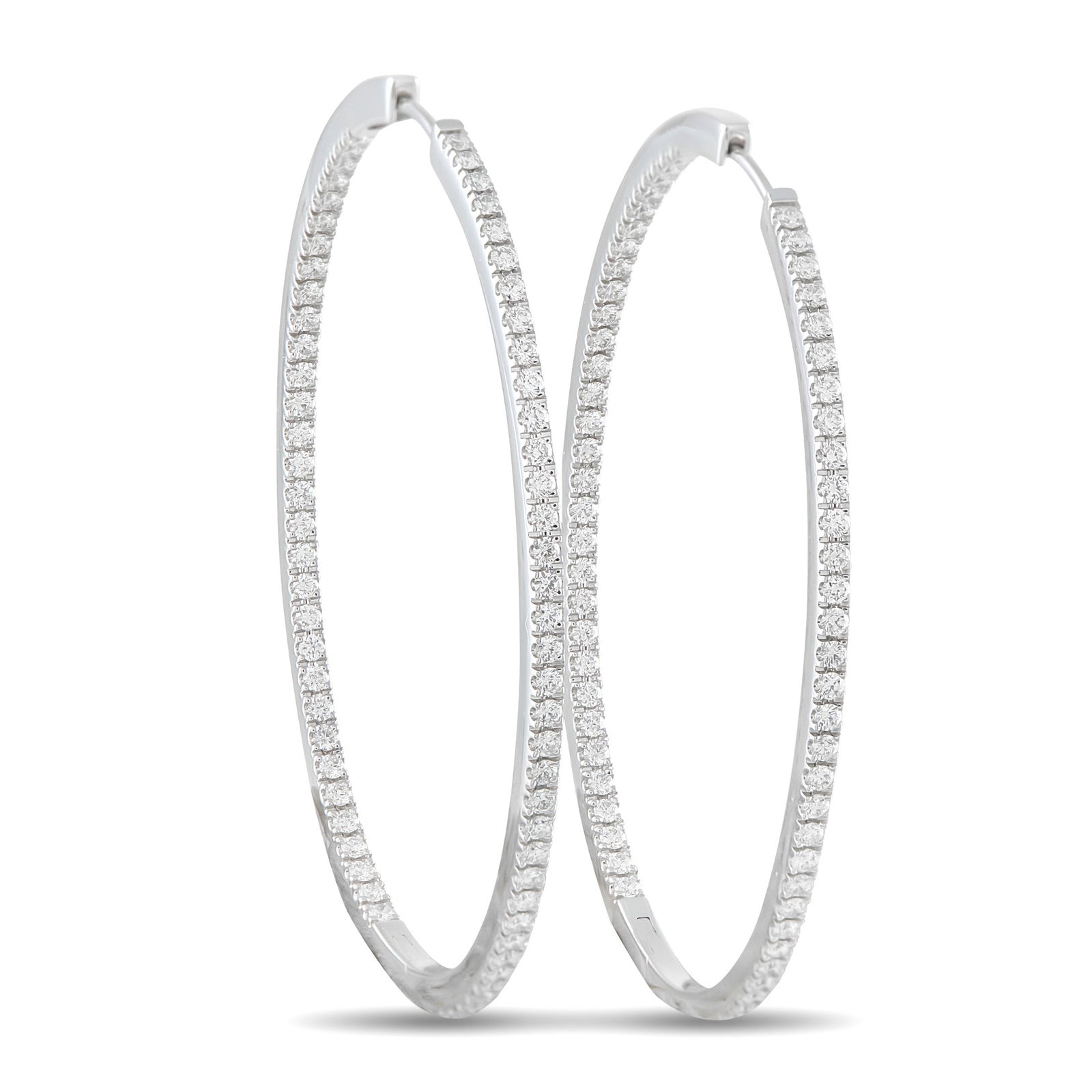 Memoire 1.45ctw Diamond and 18K 1.80" Hoop Earrings: Memoire 1.45ctw Diamond and 18K White Gold 1.80" Hoop Earrings - These elegant Memoire hoop earrings offer a refined balance of classic design and understated luxury. Crafted in 18K white gold, each h