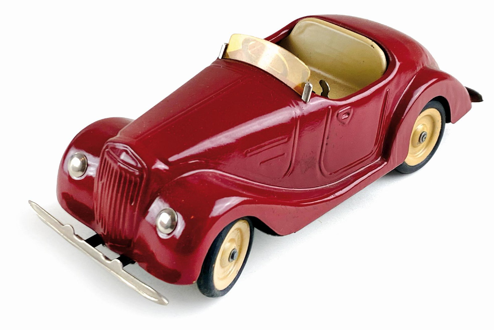 Auto Ardea Spider: Ditta Omicron, Italia, anni '40. Latta serigrafata. Cm 19x8x7. Meccanismo a molla funzionante con chiavetta originale; cambio di velocità a tre marce; in confezione originale in discreto stato comple