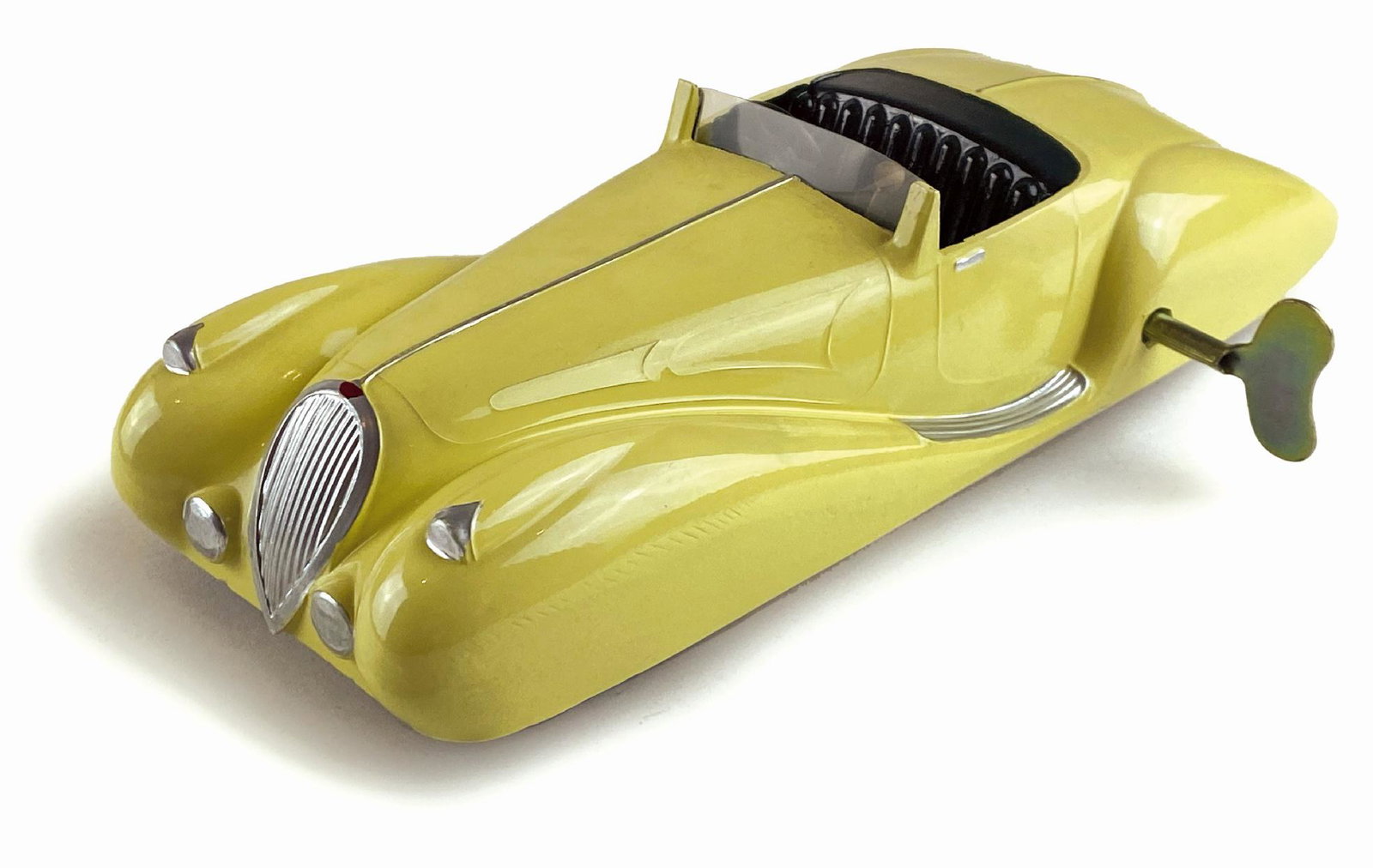 Auto Cabriolet: Ditta Figoni et Falaschi, Francia, fine anni '30. Latta dipinta con cambio funzionante e volante sterzante. Cm 24x9x5,5. Meccanismo a molla funzionante. Eccellente stato. ENG Ditta Figone et Falaschi,