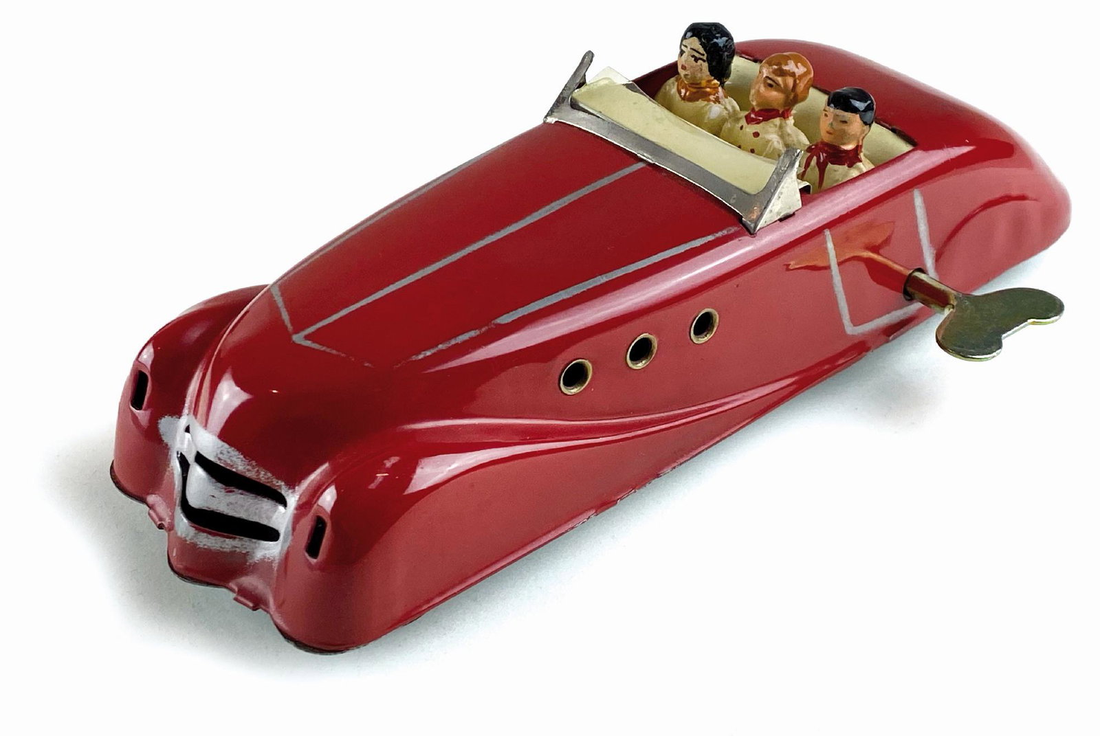 Auto Cabriolet a tre posti: Senza indicazione della ditta produttrice ma realizzata in Francia, anni '50. Latta serigrafata; con autista e due passeggeri. Cm 23x7x6. Meccanismo a molla da revisionare. Buono stato. ENG No manufac