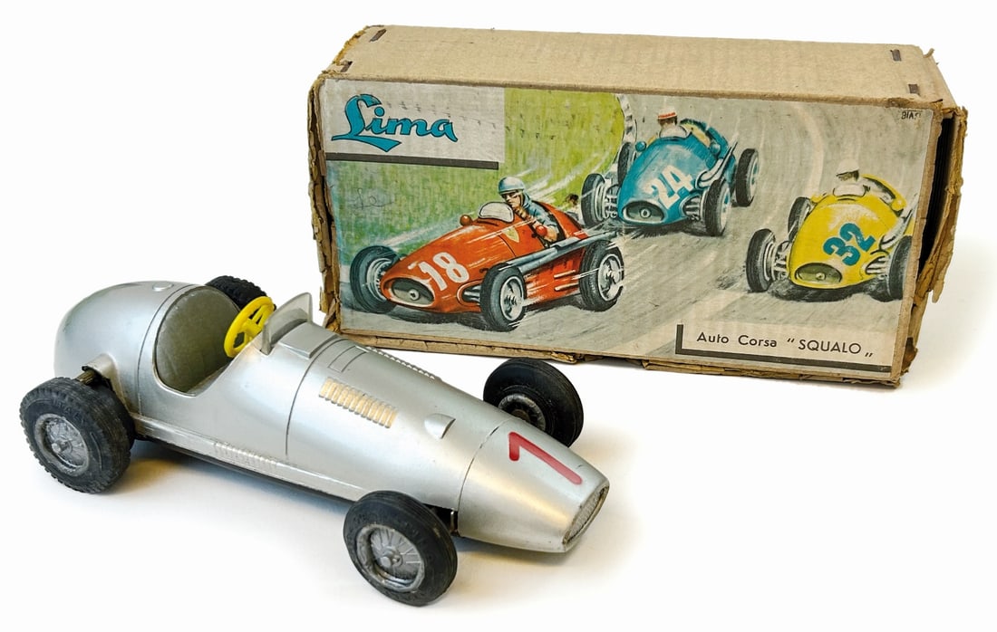 Lima Auto da Corsa Squalo: Auto da corsa in plastica e latta, movimento a frizione. cm 20. Anni '50. Made in Italy. Nuova, in confezione figurata da Biasi, quest'ultima in discreto stato. ENG Plastic and tin racing car, frictio