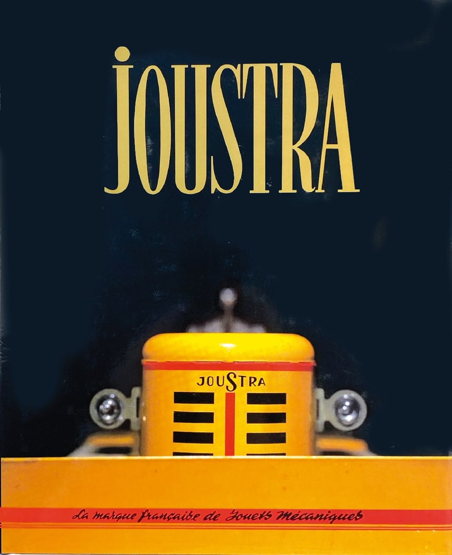 Joustra: La Marque Francaise de Jouets: Joustra: La Marque Francaise de Jouets Mécaniques. Di Dominique Herbert e Gérard Chauvière, ed. Fabrication Joustra Francaise, 1990. Cartonato con sovraccoperta, 29x23,5; pp. 128 b/n e col. ENG By