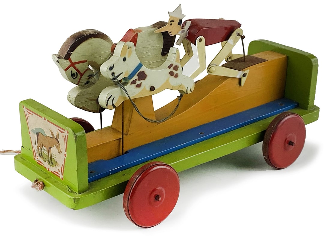 Pinocchio Ventura: Gioco da trascinamento di gusto futurista prodotto dalla Ditta Ventura, anni '30/40. Lunghezza cm 25, altezza cm 16, larghezza cm 8. Funzionante. Buono stato.