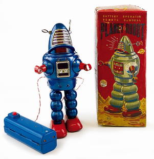 BATTERY-OPERATED PLANET ROBOT ORIGINAL BOX: KO JAPANESE TIN LITHO BATTERY-OPERATED PLANET ROBOT ORIGINAL BOX. Yoshiya KO, Giappone, 1959. In latta litografata, altezza cm 24; a batteria, filoguidato. Minime bruni­ture alla mascherina ma