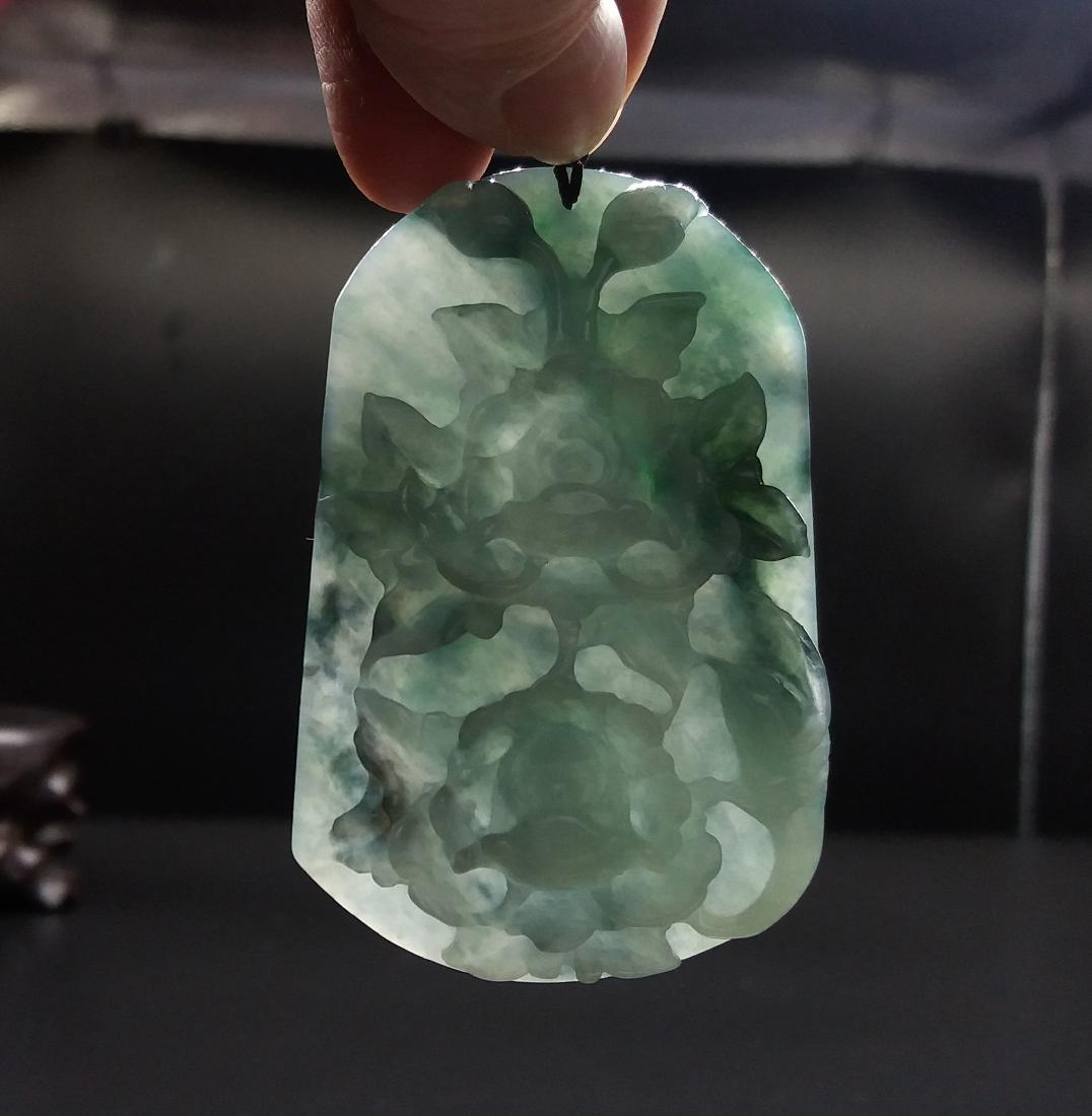 A Big Nice Nature Icy Waxy Jadeite Pendant: Nature Jadeite Grade A,very beautiful deep Carvings. The pendant much nicer than the pictures. Size is around 4.5x7x1cm. Weight is around 84.8g.