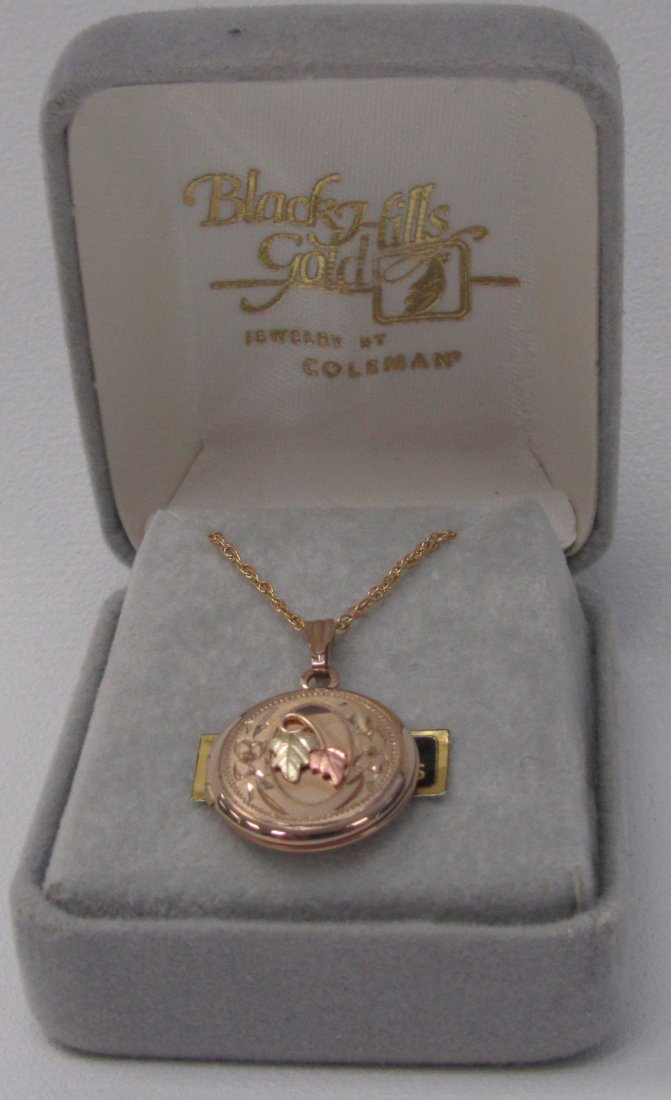 Black Hills Gold Locket With Gold Filled Chain: Black Hills Gold Locket With Gold Filled Chain. Very nice intimate piece to give a girlfriend or wife or daughter. Opens up to put a small picture in.