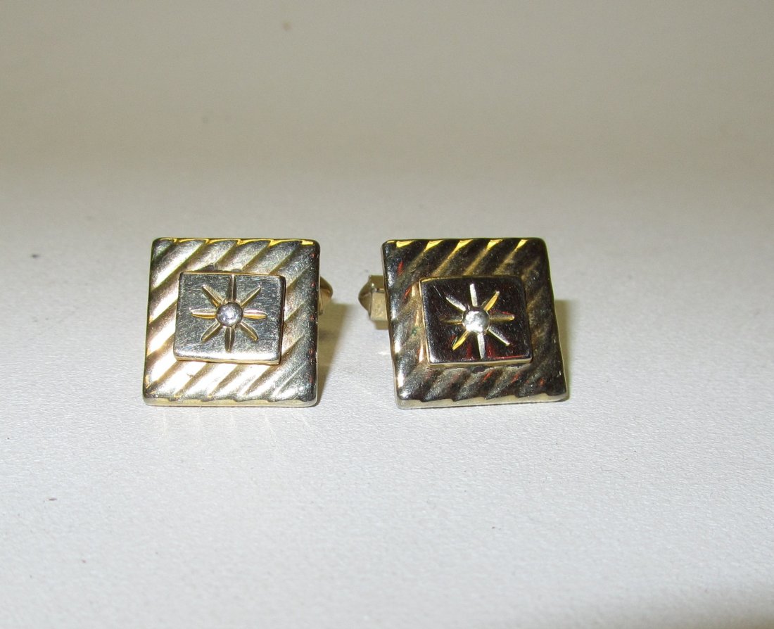 Pair of Gold Cufflinks: Pair of Gold Colored Cufflinks with rhinestone center