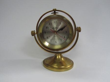 Seth Thomas Model 1044 Schooner Brass Clock: Seth Thomas Model 1044 Schooner Brass Clock. It is bent a little and is loose. Runs on a AA battery and does work.