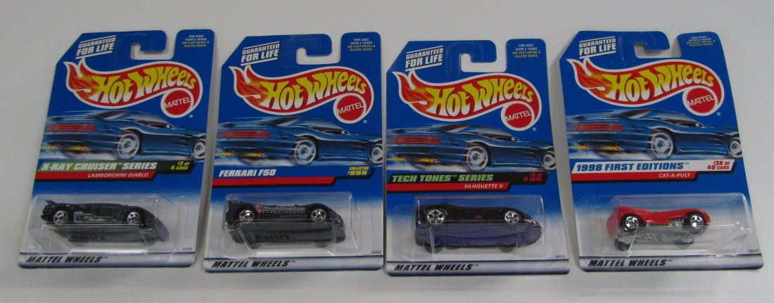 4 New In package Hot Wheels: 4 New In package Hot Wheels. X-Ray Cruiser Series Lamborghini Diablo, Ferrari F50, Tech Tones Series Silhouette II, and 1998 1st Editions Cat A Pult