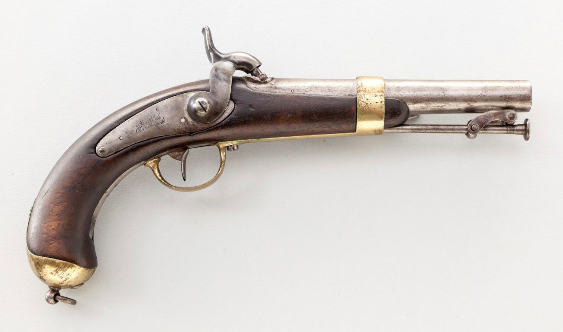French Navy Model 1837 Percussion Pistol: French Navy Model 1837 Percussion Pistol, NVSN, .52 cal., 6'' barrel, finished in the white, brass furniture, walnut stock, with belt clip, ramrod, and 1837 date to upper tang. Hammerspur shows signs