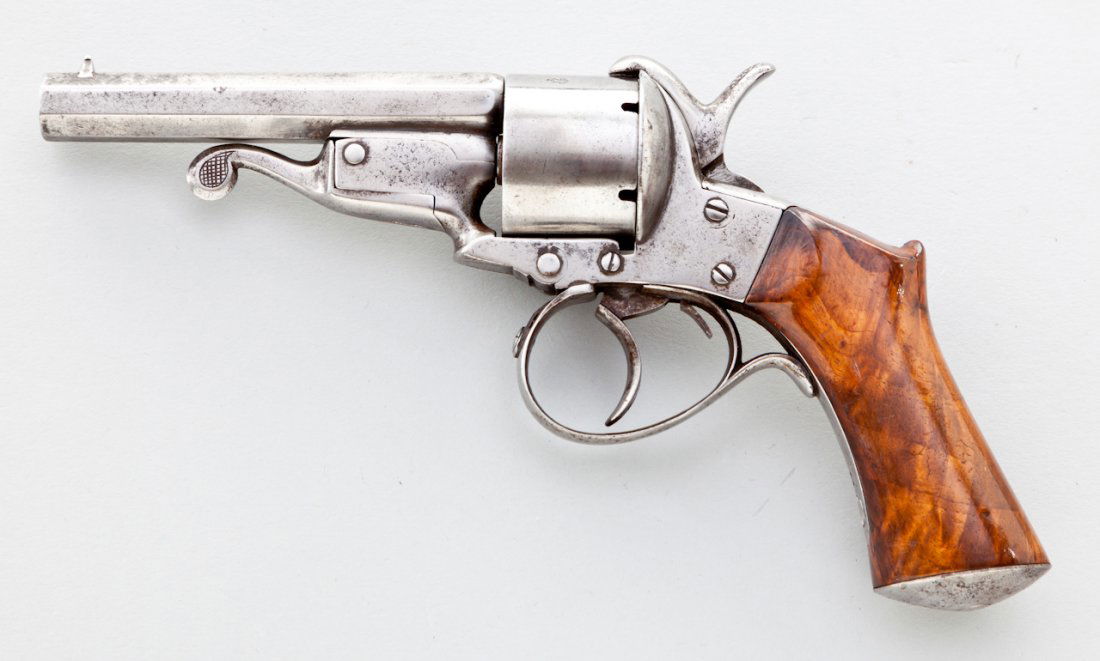 Underlever French Pinfire Revolver: Underlever French Pinfire Revolver, by Javelle/St. Etienne, #153, 9mm PF cal., 3-3/4'' octagon barrel, burnished finish, one-piece saw-handled fancy grade walnut grips. Condition is very good with ove