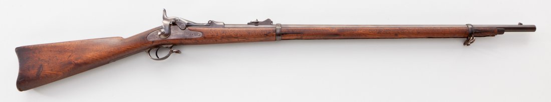 Springfield Model 1873 Trapdoor Rifle: Springfield Model 1873 Trapdoor Rifle, #212537, .45-70 cal., 32-1/2'' barrel, blue finish, walnut stock, early 1873 rifle sight, 1873 dated breechblock. Condition is good to very good with approx. 30%
