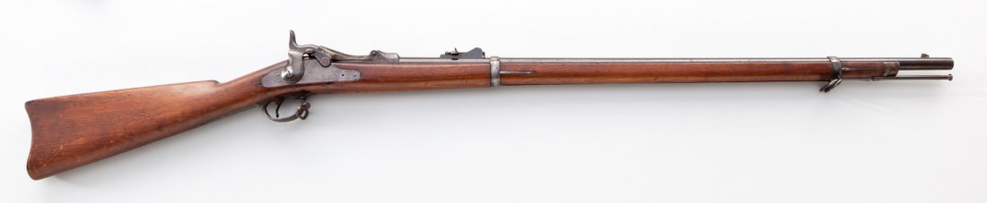 Springfield Model 1873 Trapdoor Rifle: Springfield Model 1873 Trapdoor Rifle, #257229, .45-70 cal., 32'' barrel, blue finish, case hardened breechblock, full-length 1884 cartouched stock. Condition is about very good with light toning and 