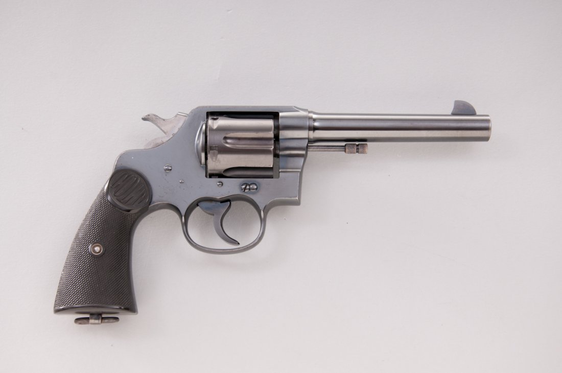 Colt New Service Double Action Revolver: Colt New Service Double Action Revolver, #319376, .38-40 cal., 5-1/2'' barrel, blue finish, factory checkered hard rubber grips. Mfg'd 1923. Condition is excellent retaining approx. 97%+ original blue