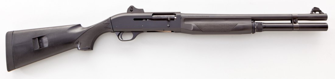 Benelli M1 Super 90 Semi-Automatic Shotgun: Benelli M1 Super 90 Semi-Automatic Shotgun, #M496659, 12 ga., 18-1/2'' barrel, matte finish, tactical sights, checkered black plastic stock. Condition is excellent showing just light marks from handli