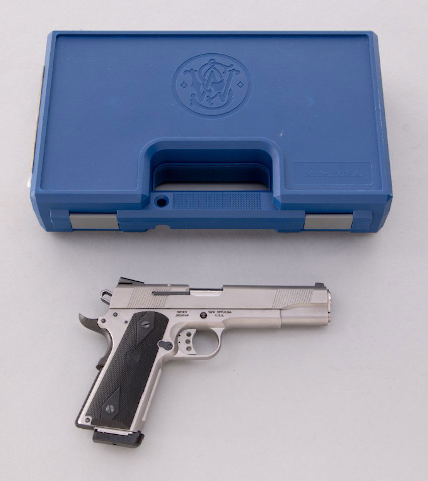 Smith & Wesson Model SW1911 Semi-Automatic Pistol: Smith & Wesson Model SW1911 Semi-Automatic Pistol, #JRD6949, .45 ACP cal., 5'' barrel, stainless steel finish, black checkered S&W rubber grips. In original blue plastic hard case with two magazines,