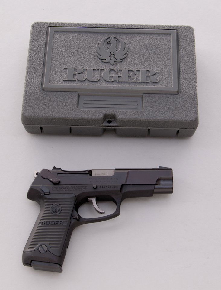 Ruger Model P89 Semi-Automatic Pistol: Ruger Model P89 Semi-Automatic Pistol, #310-38706, 9mm, 4-3/8'' barrel, blue finish, factory grips. In original black plastic hard case with two magazines, extra set of Pachmayr grips, and all associa