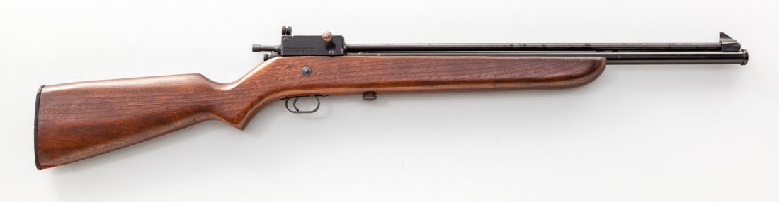 Crosman Model 118 Repeating Gas Rifle: Crosman Model 118 Repeating Gas Rifle, .22 cal., 21-1/4'' barrel, black painted finish, peep sight, dark stained wood stock. Condition is excellent with just some light losses to paint.