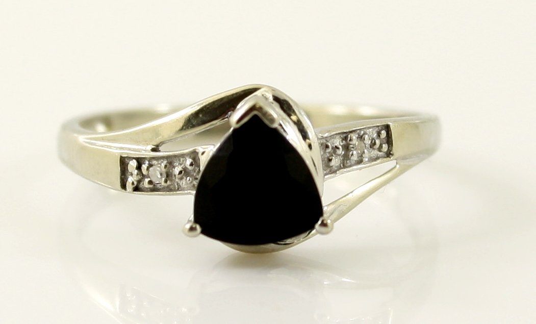 10KT WHITE GOLD DIAMOND BLACK SAPPHIRE RING: A very fine 10kt solid white gold .417 purity natural BLACK SAPPHIRE SOLITAIRE PROMISE RING. This ring features one trilliant cut shaped natural black sapphire gemstone. This ring is electronically te