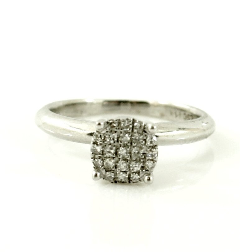 14KT WHITE GOLD MICRO PAVE DIAMOND SOLITAIRE RING: A very fine 14kt solid white gold genuine diamond ring. Yhis ring features .10 ctw of round white diamonds in micro pave setting. This ring is a size 5 and weighs 3 grams of 14kt solid white gold. Thi