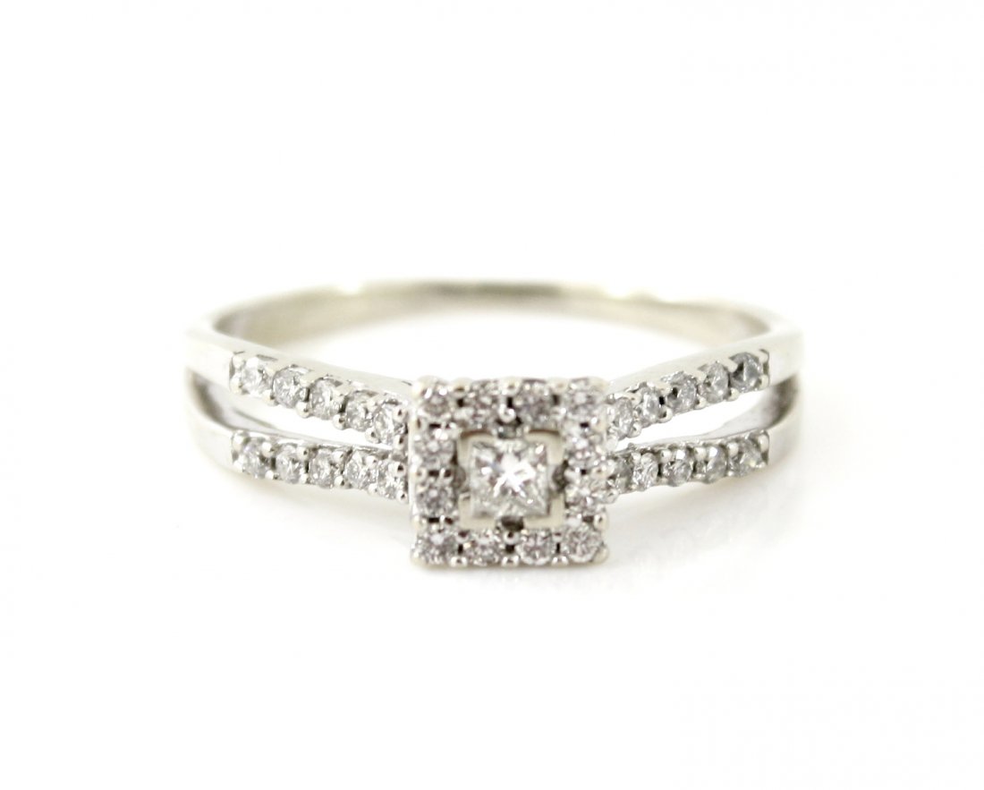 14KT GOLD .50 CT PRINCESS CUT DIAMOND WEDDING RING: A very fine 14kt solid white gold princess cut diamond engagement ring. This ring features one .15 carat princess cut diamond in the center with a clarity grade of SI1 and color of H. The center diamo