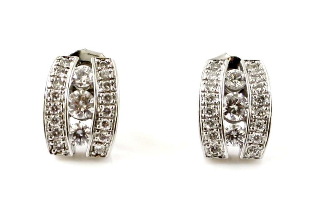 14KT WHITE GOLD .60 CTW WHITE DIAMOND EARRINGS: A very fine 14kt solid white gold diamond pair of earrings. These earrings feature .60 ctw of fine white diamonds set beautifully into the 14kt solid white settings. The earrings are 7x9mm each and we