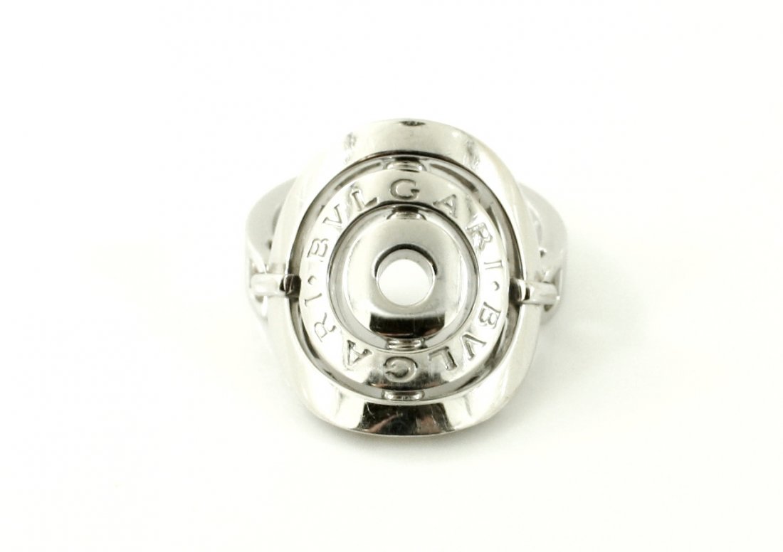 BVLGARI ASTRALE SHIELD 18KT WHITE GOLD RING: A very fine 100% AUTHENTIC BVLGARI ASTRALE SHIELD ring .750 18kt solid yellow gold ring. This ring is fully signed, stamped and hallmarked. The ring is a size 9 and weighs 10.3 grams of 18kt solid whi