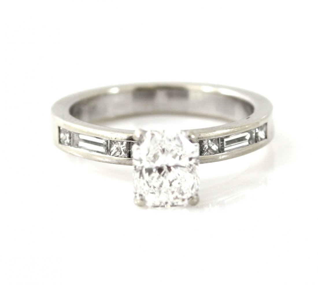 EGL USA 1.54 CTW RADIANT CUT DIAMOND WEDDING RING: A very fine EGL certified radiant cut diamond engagement ring. This ring features 1 radiant cut diamond with a weight of 1.24 carats. The center diamond has a clarity grade of SI2 and a color grade of