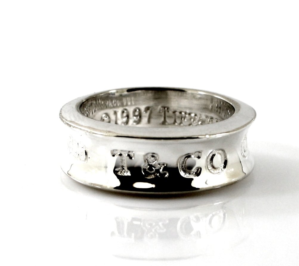 WOMEN'S TIFFANY & CO STERLING SILVER 1837 RING: A very fine Tiffany & Co. .925 sterling silver ring. This ring is from the Tiffany & Co. 1837 collection. The year 1837 inscribed on this beautiful ring is when Tiffany was founded. ( WE INSPECT AND T