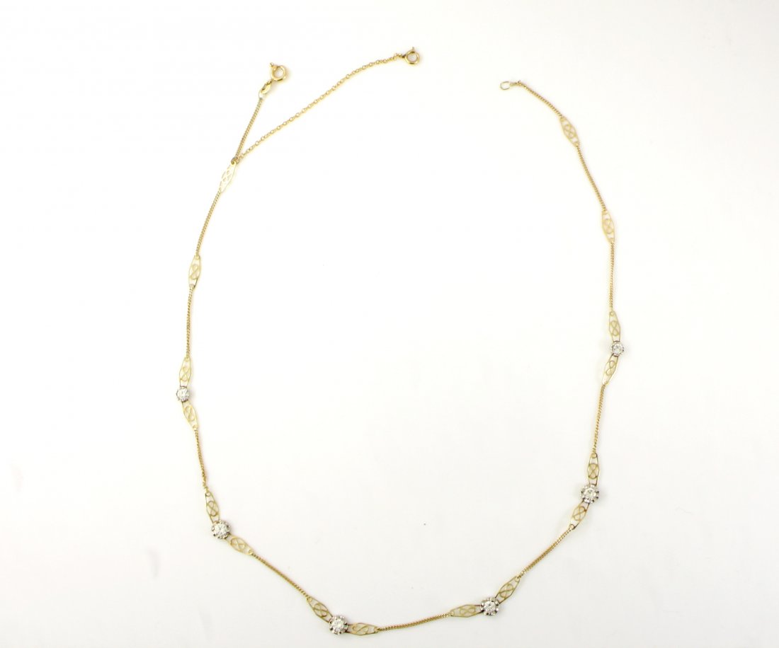 VINTAGE 14KT GOLD DIAMOND CHAIN LINK NECKLACE: A very Women's 14kt Italy solid gold stone diamond necklace. This delicate yet intricate necklace features 6 round brilliant diamonds approx .15 carat each with a clarity grade of VS or better no less