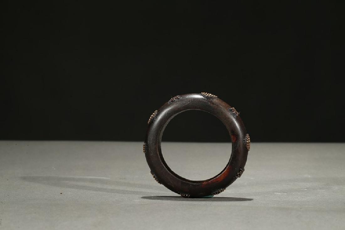 AN AGARWOOD 'GOLD BEAD' BANGLE (1 of 6)
